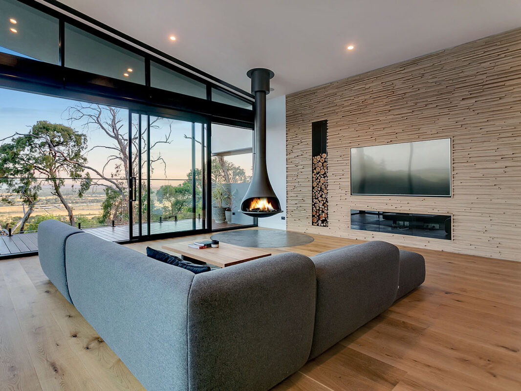 Black JC Bordelet Tatiana Luxury Suspended Fireplace in living room.